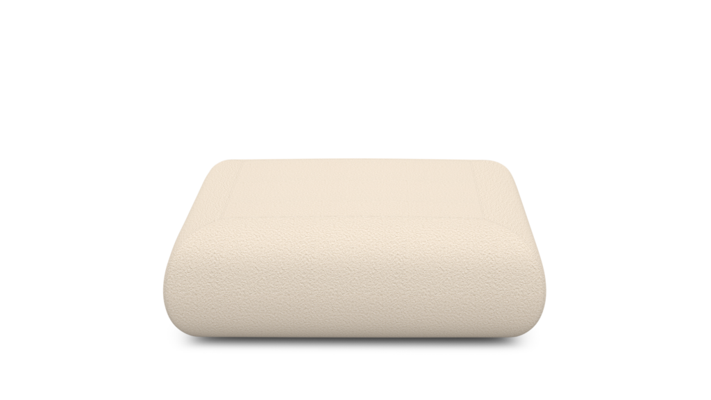 A Sval Ottoman in Cream viewed from the front
