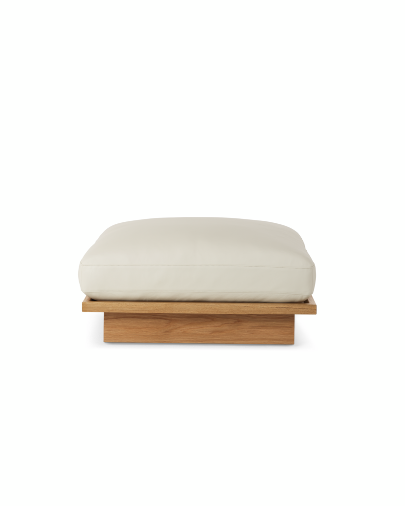 Pawson Drift Ottoman with white leather upholstery and white oak base, viewed from the front.