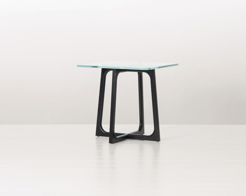 A square Loophole side table with a glass top and ebony-ash base.