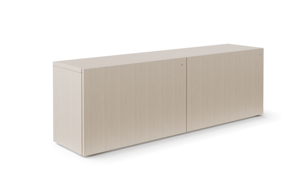 A credenza with closed front doors is viewed in a light veneer.