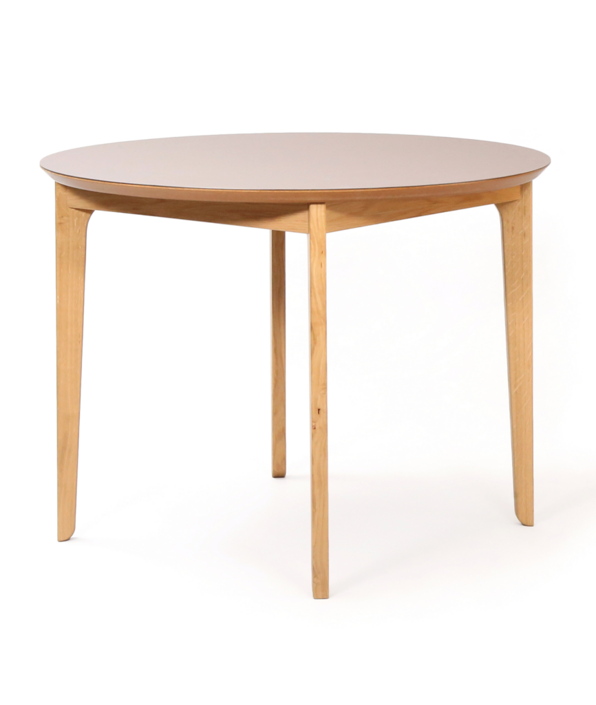 A round naughtone Dalby Café Table, viewed at an angle.