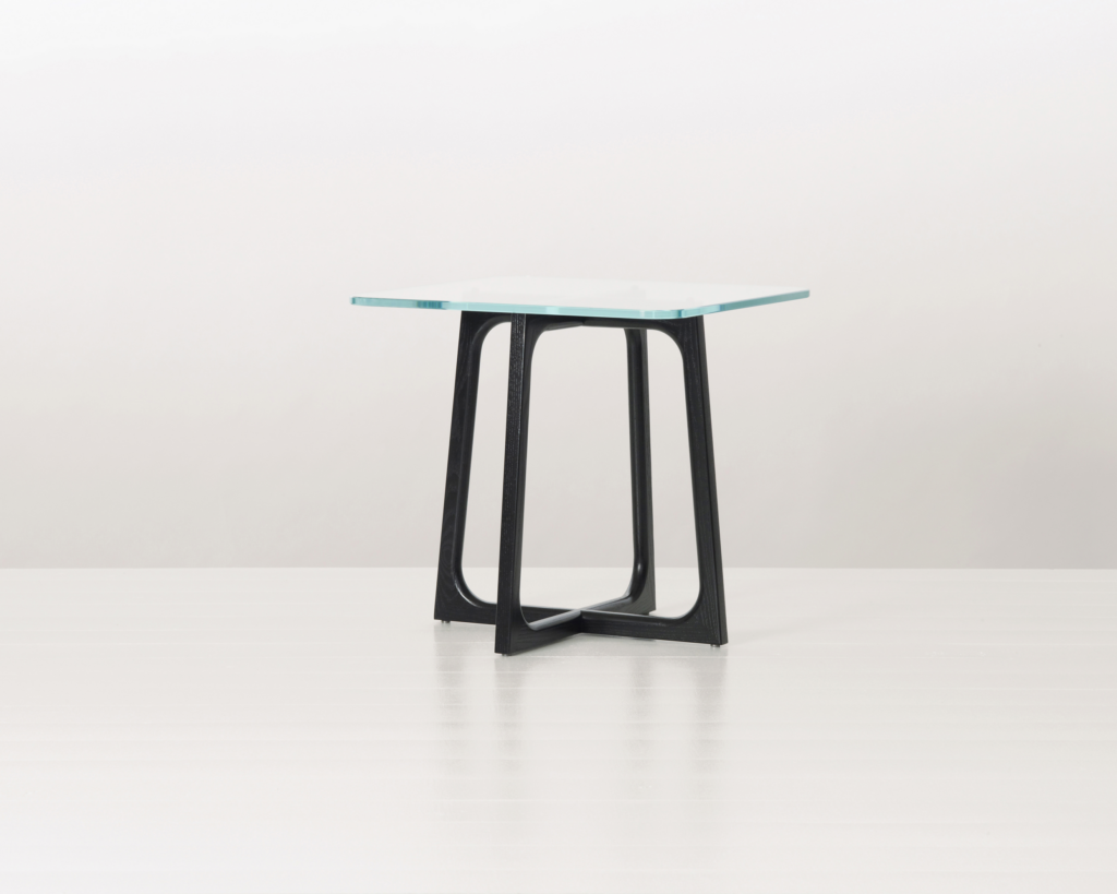 A square Loophole side table with a glass top and ebony-ash base.