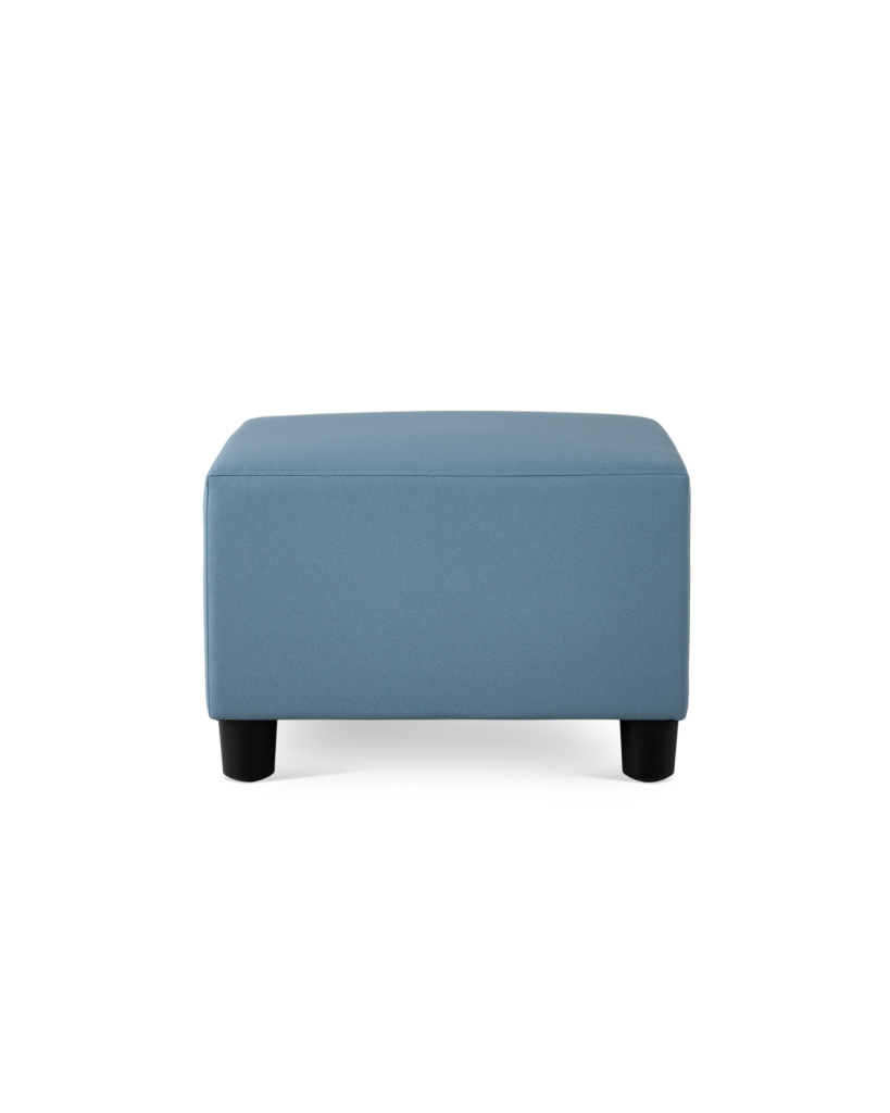 A Swoop Ottoman in blue upholstery.