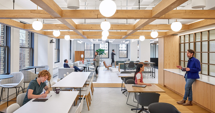 About COR — open office with wood-beam ceiling