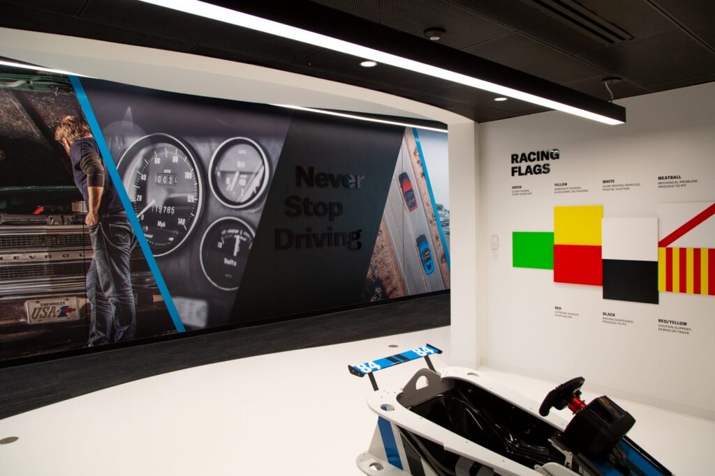 Hagerty storytelling wall with gauges and a racing flags display